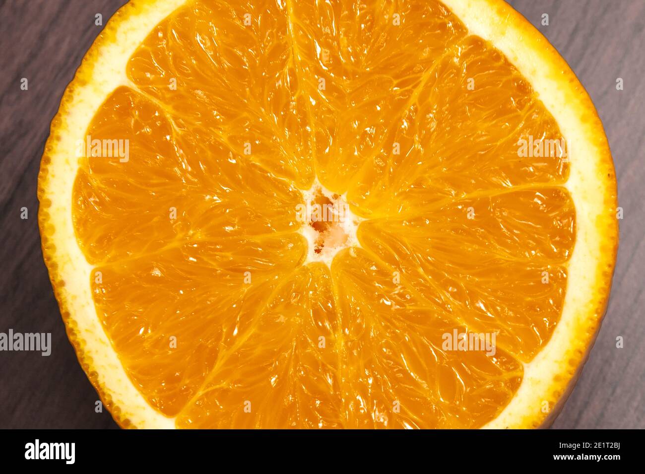 Fresh, jucy, orange on light wooden background. Stock Photo