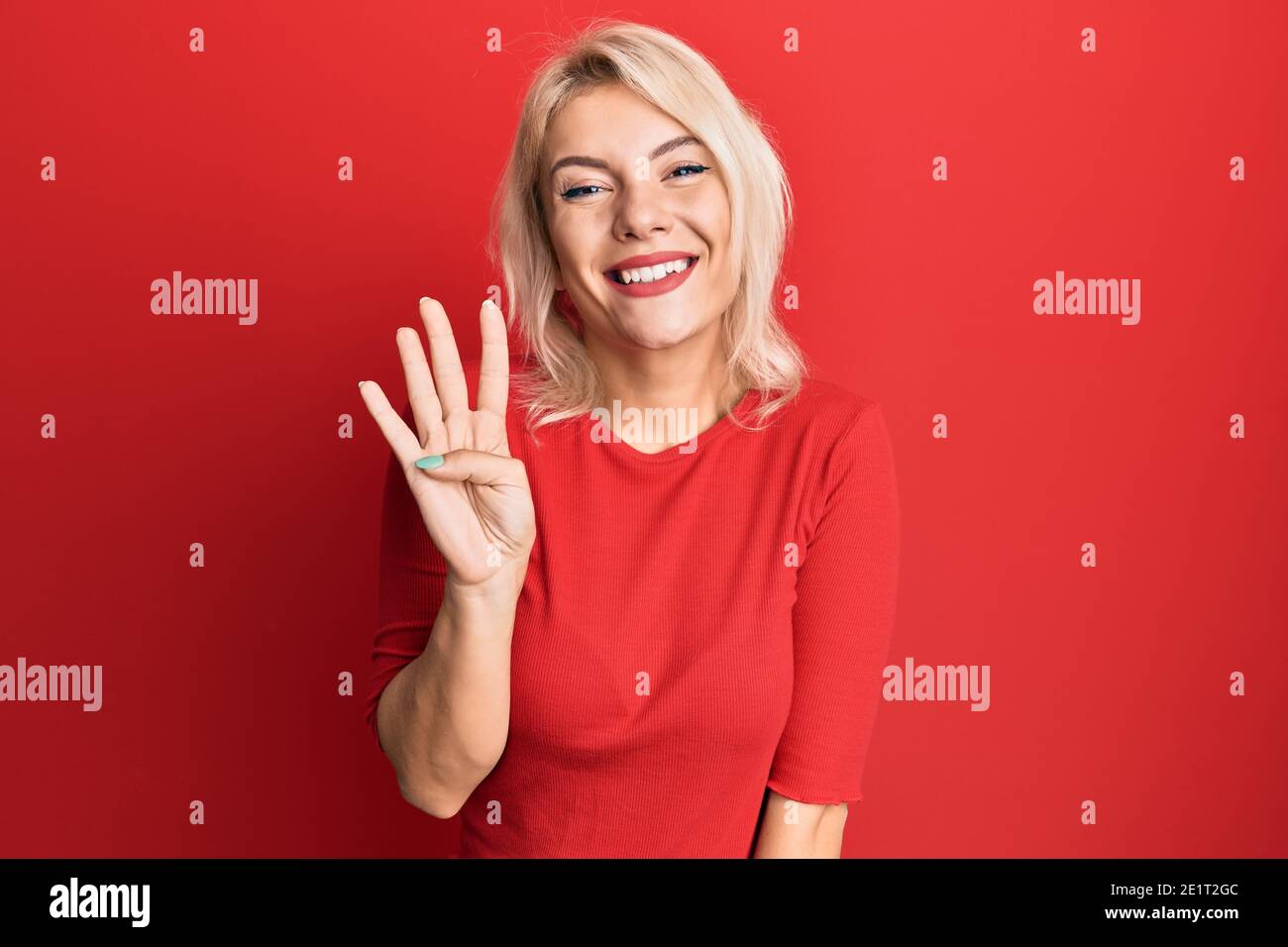 young-blonde-girl-wearing-casual-clothes-showing-and-pointing-up-with