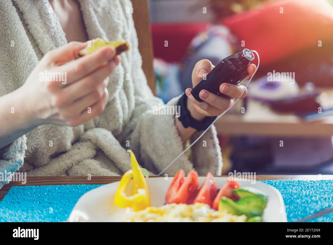 Modern diabetes treatment, woman checking glucose level and dosing