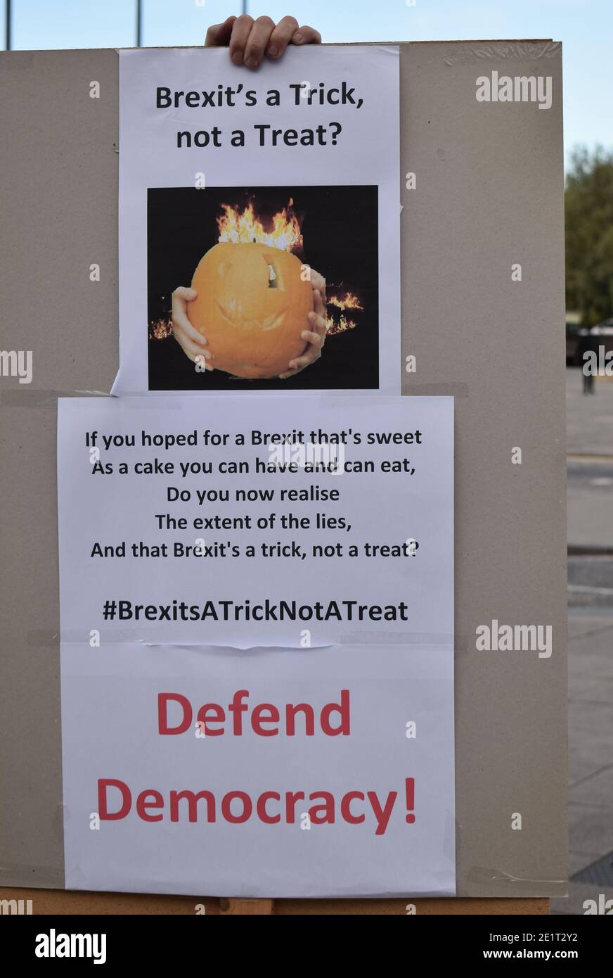 A Halloween-themed placard at a demonstration: 'Brexit's a Trick, not a Treat, Defend Democracy!' Stock Photo