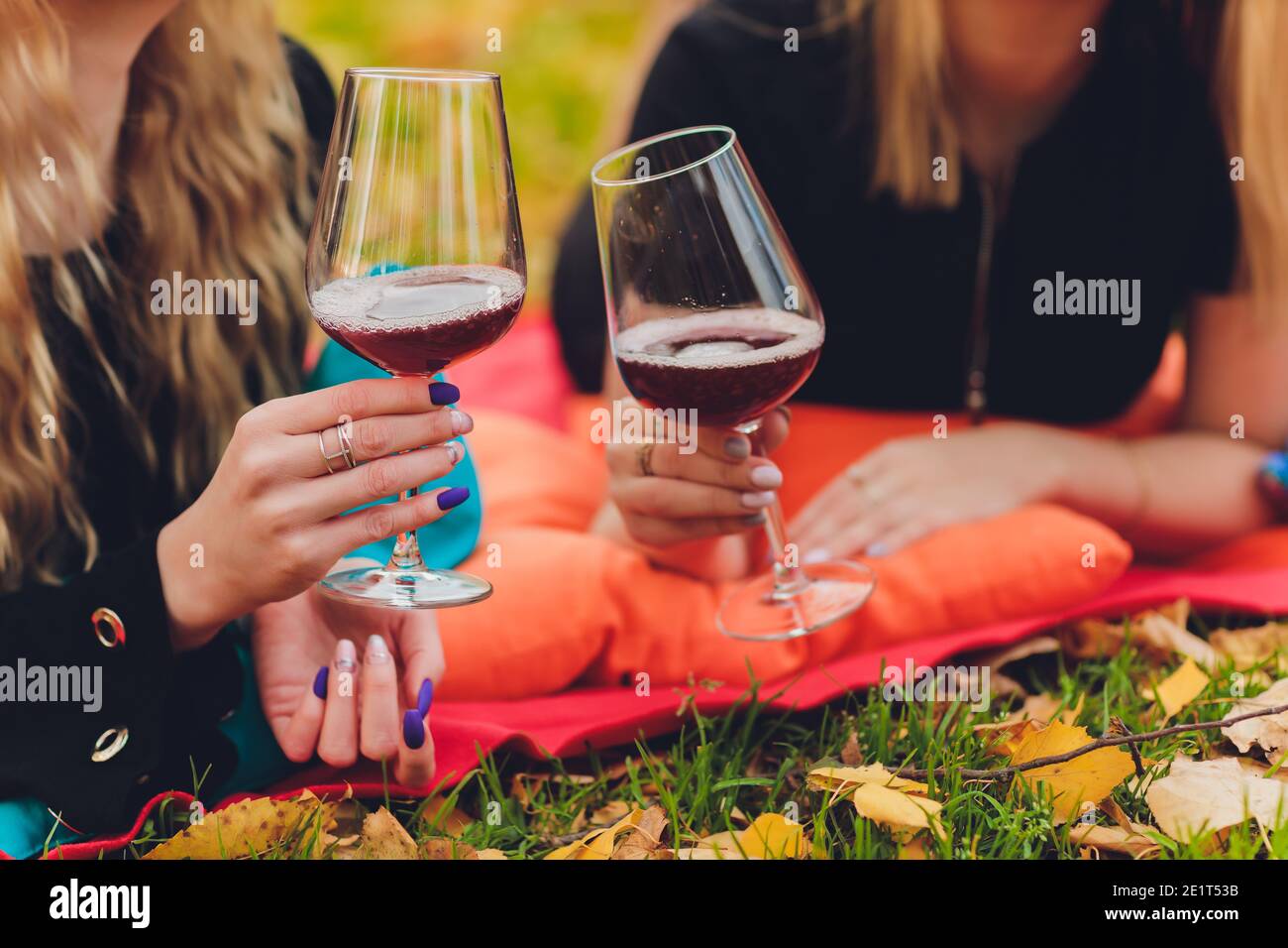 Lovers clinking wine glasses in nature for the love. Cheers Hands holding wine  glass. Green background. Bokeh. Celebration. Wedding. Woman, man Stock  Photo - Alamy