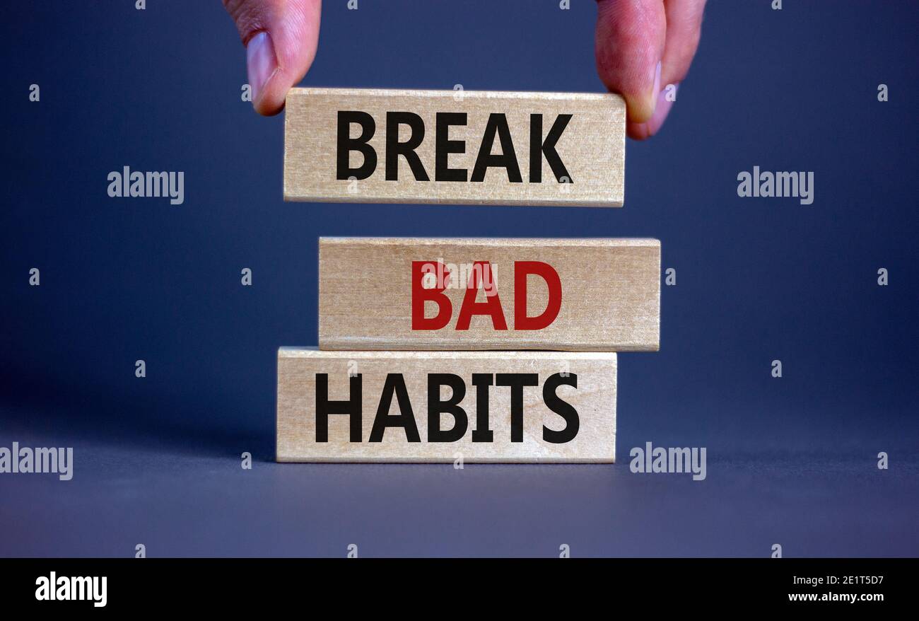 Break bad habits symbol. Wooden blocks with words 'break bad habits ...