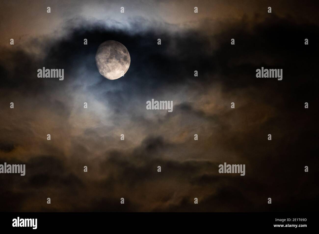 Moon through clouds Stock Photo