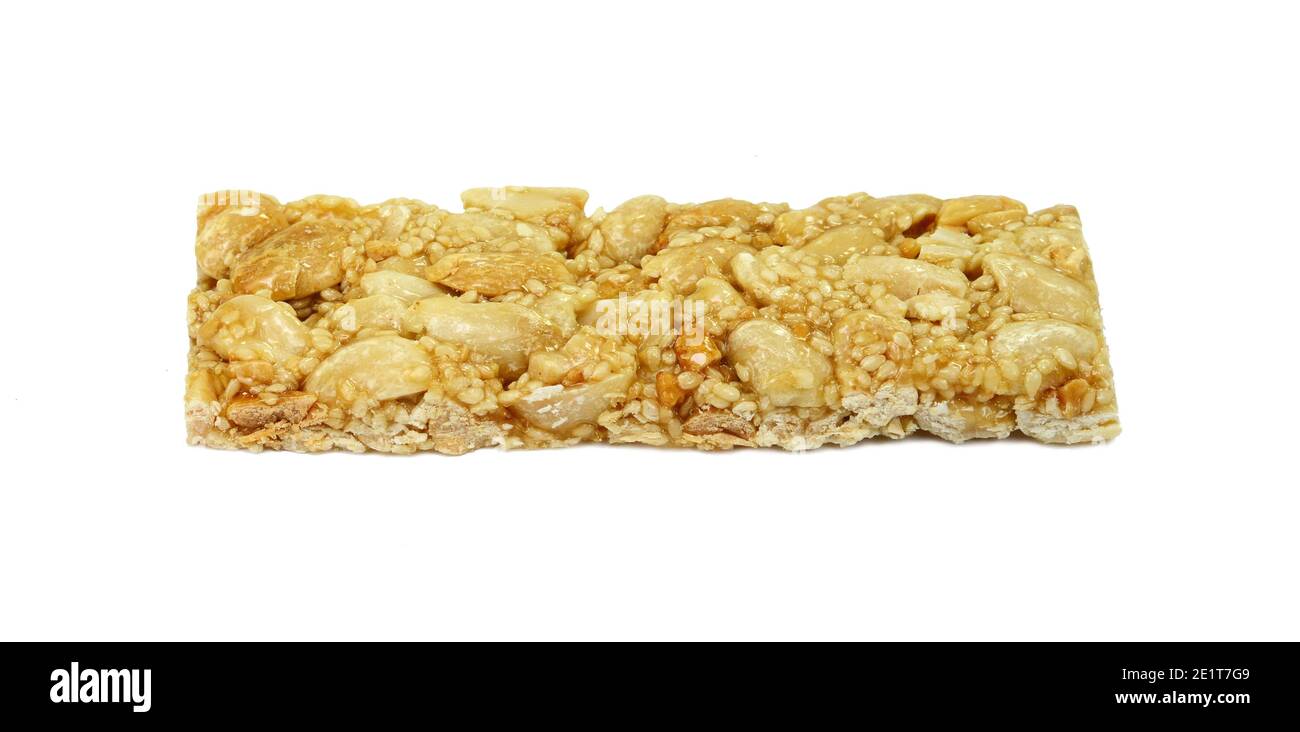 Honey bars with peanuts, sesame and sunflower seeds isolated. Peanut and sesame brittle on white