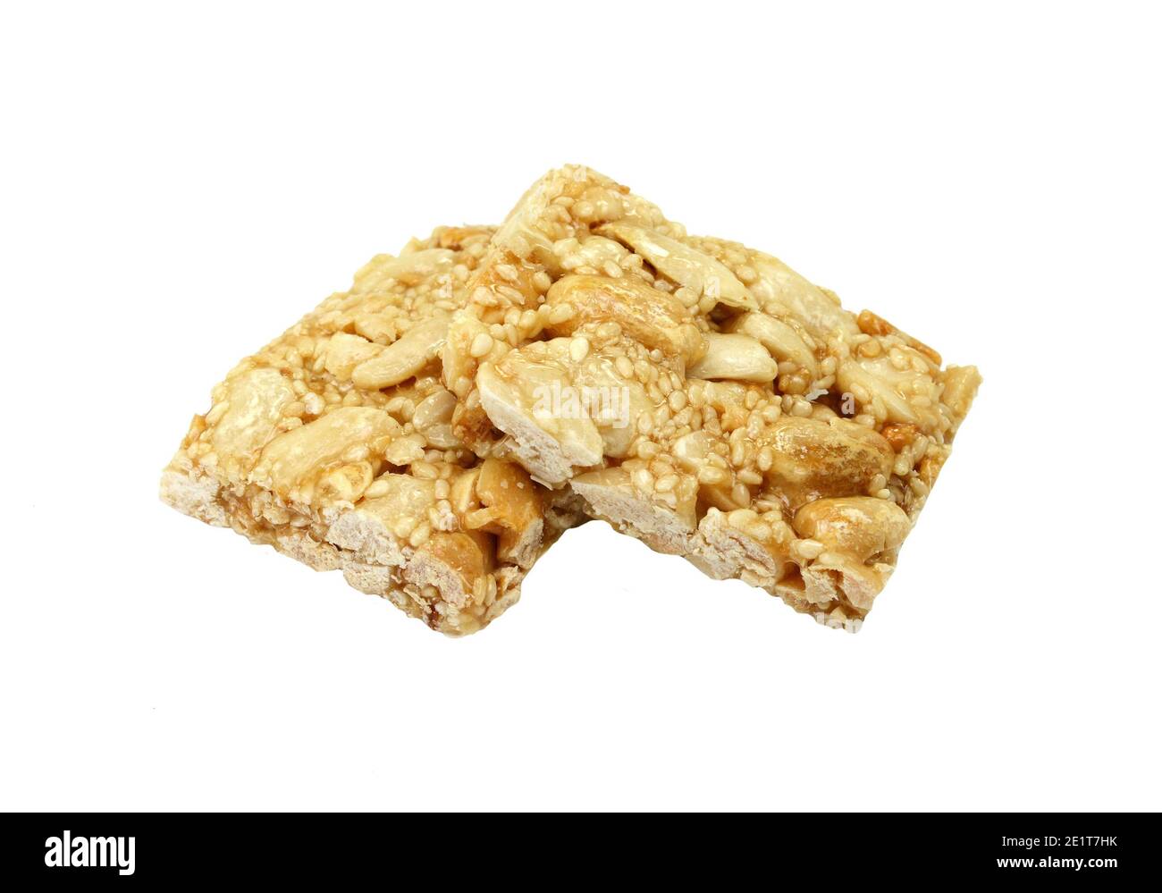 Honey bars with peanuts, sesame and sunflower seeds isolated. Peanut and sesame brittle on white