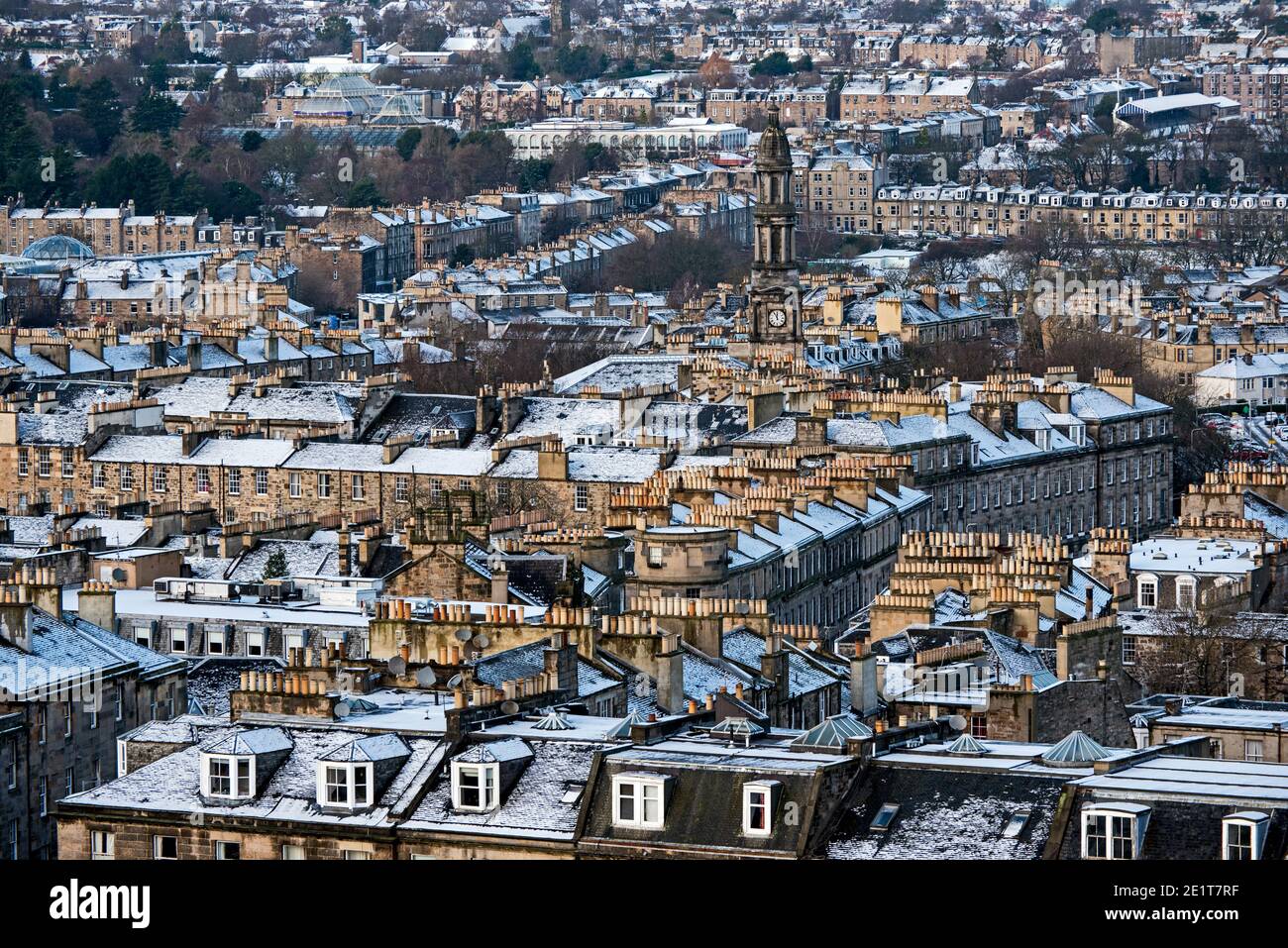 A dusting of snow covers the rooftops to the north in Edinburgh as seen from Calton Hill. Stock Photo