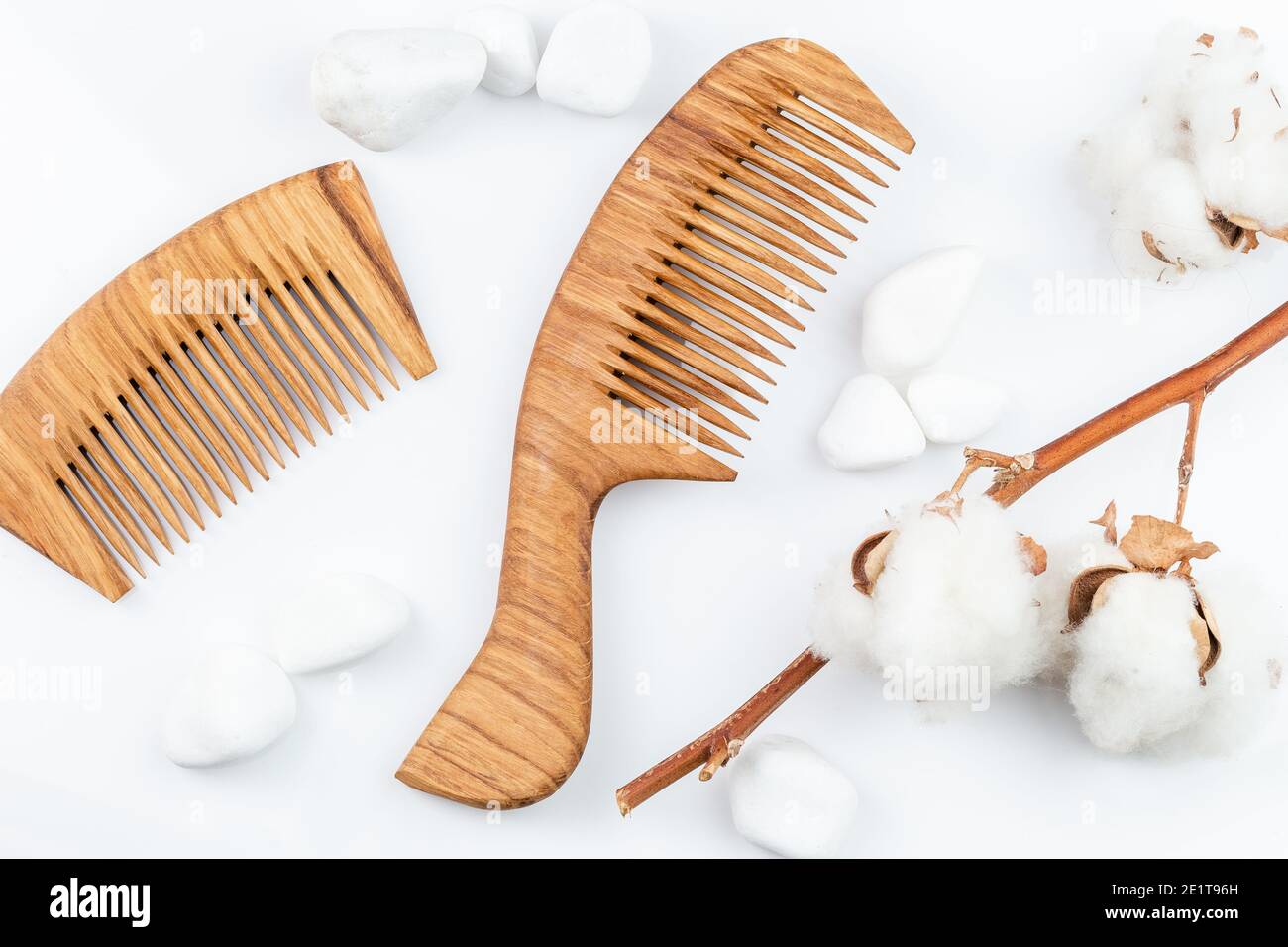 Wooden hair combs on a white background. Personal care, zero waste