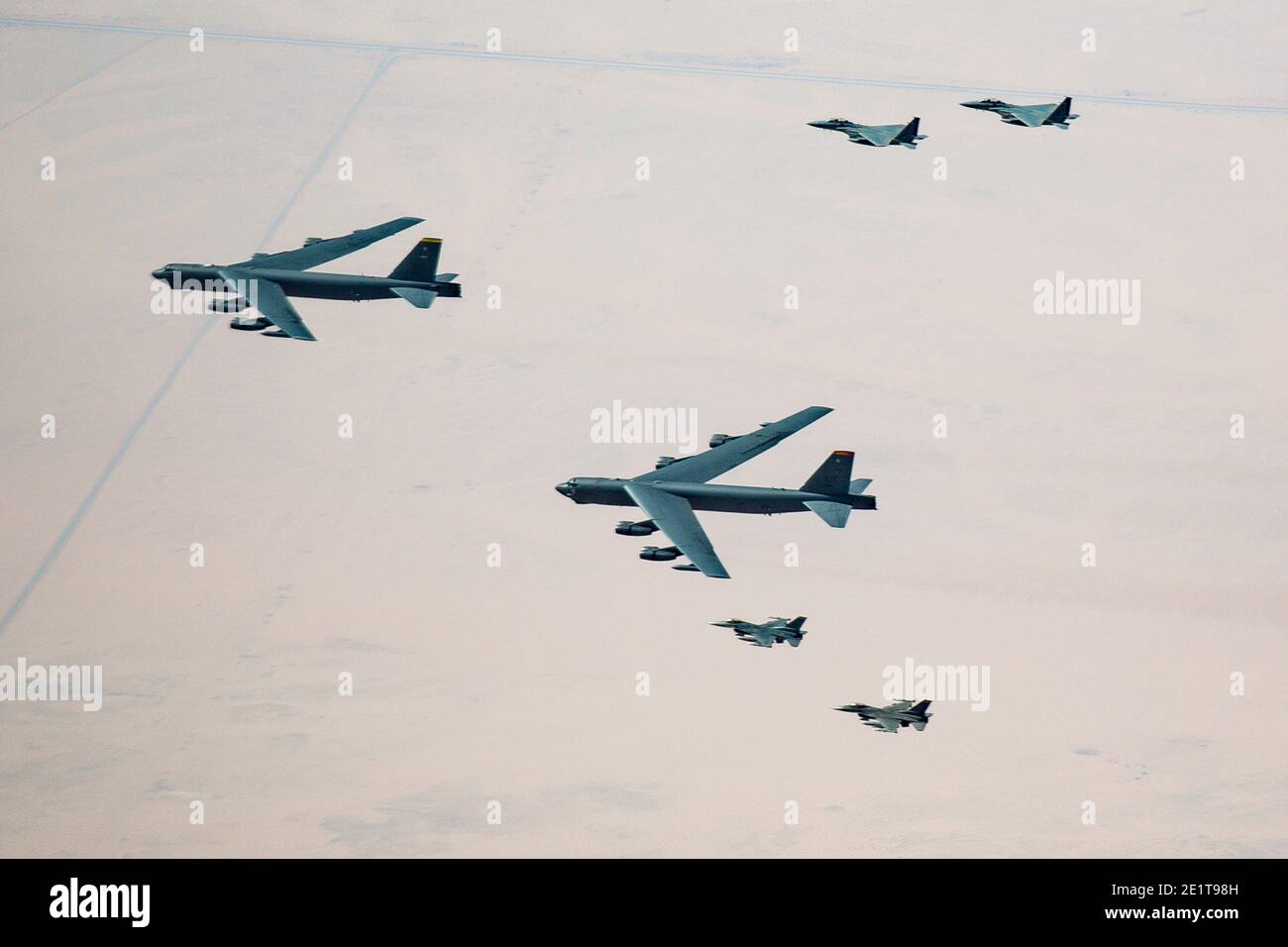 Saudi Arabia, Saudi Arabia. 07th Jan, 2021. U.S. Air Force B-52 Stratofortress strategic bomber aircraft are escorted by Royal Saudi Arabian Air Force F-15S/A fighters, right, and U.S. Air Force F-16 Fighting Falcons as they fly over Saudi airspace January 7, 2021 in Saudi Arabia. The bomber and escort is a show of force mission as a message to Iran. Credit: Planetpix/Alamy Live News Stock Photo
