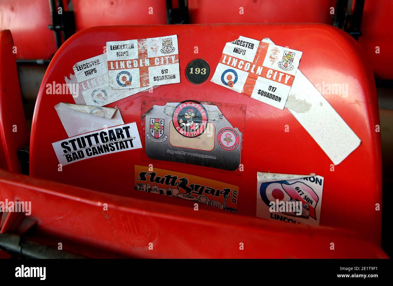 Close up of stickers on a seat in the stands during the Sky Bet League One match at the LNER Stadium, Lincoln. Stock Photo