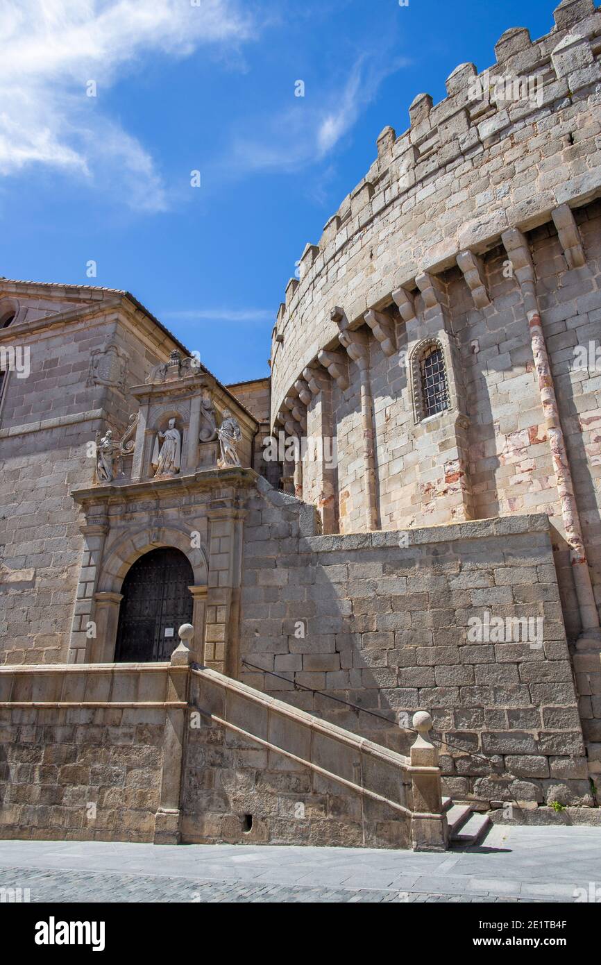 Avila - The part town walls back of Cathedral and portal of church Capila de San Segundo. Stock Photo