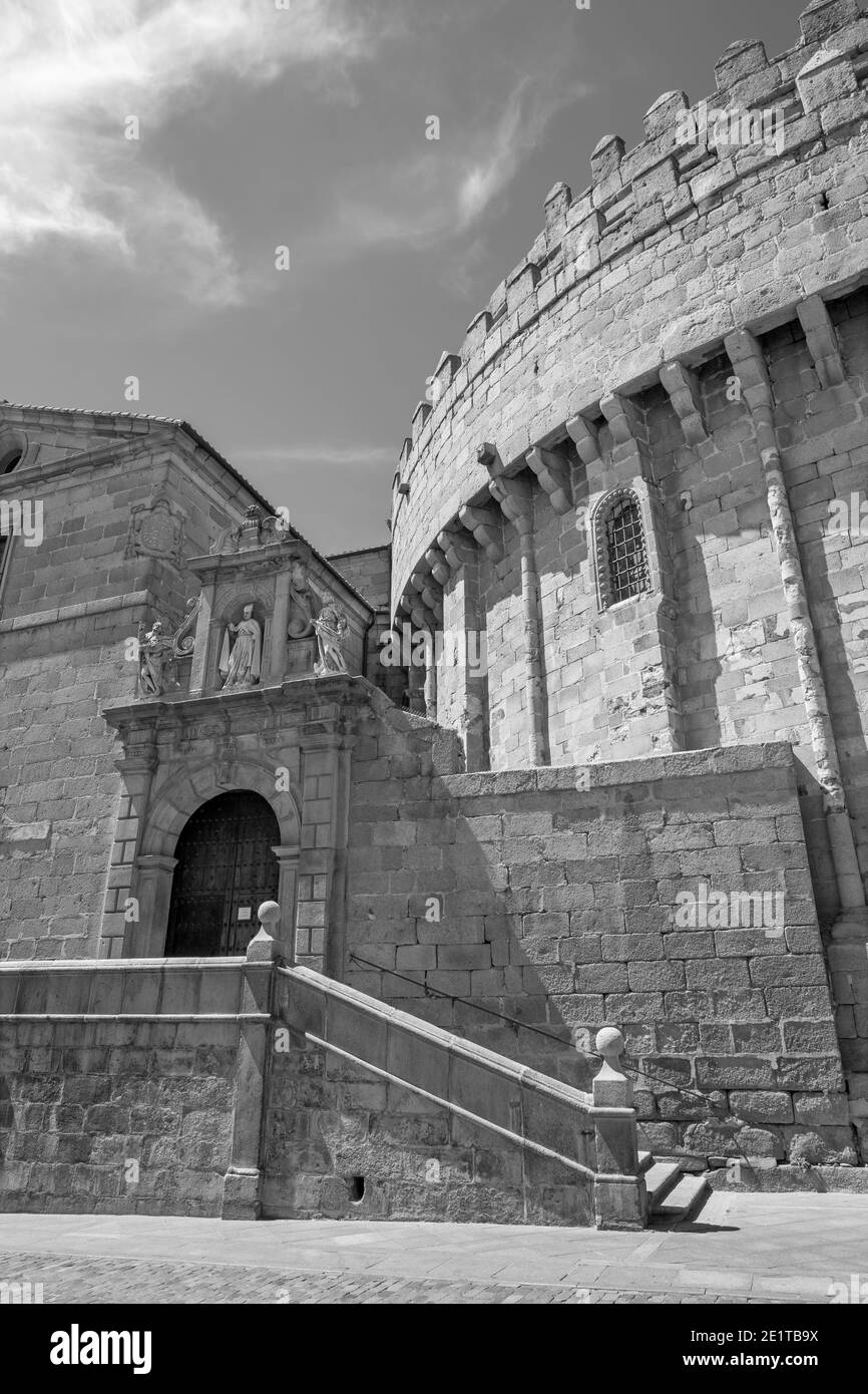 Avila - The part town walls back of Cathedral and portal of church Capila de San Segundo. Stock Photo