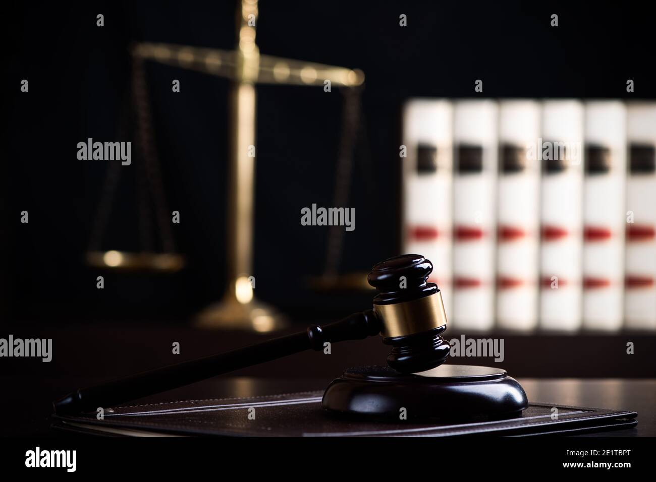 Judge gavel, scales of justice and law books in court close up Stock ...
