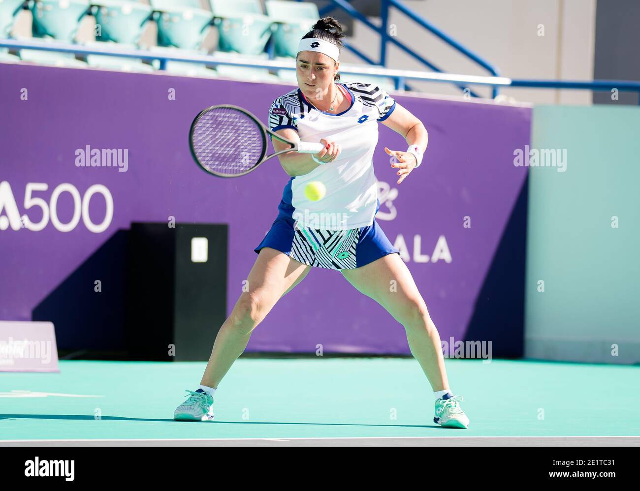 Ons Jabeur of Tunisia in action against Kateryna Bondarenko of the Ukraine during the second round at the 2021 Abu Dhabi WTA Women / LM Stock Photo