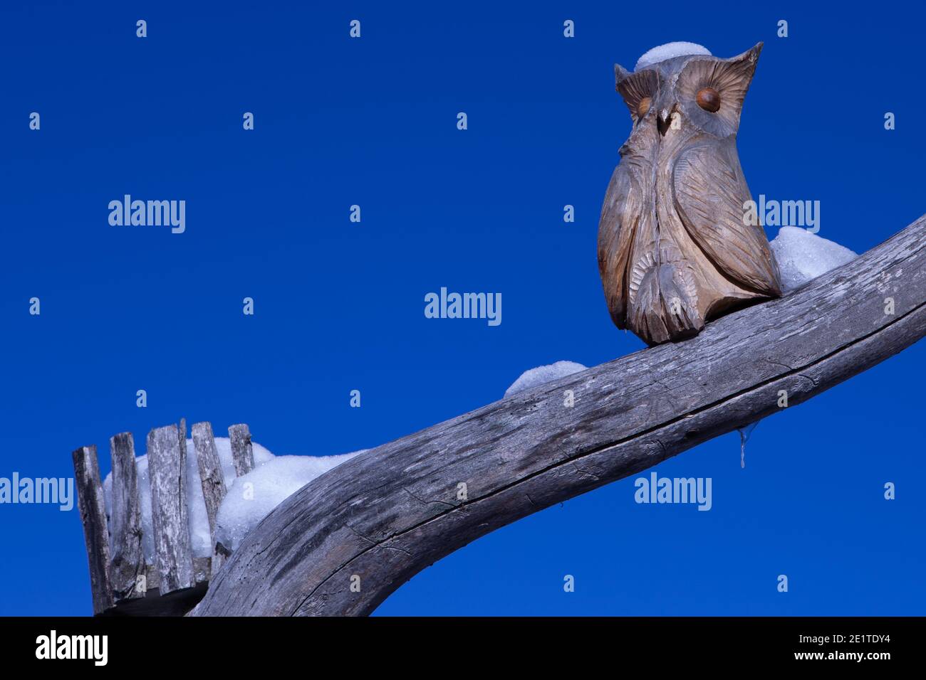 Owl carved in wood in a mountain cottage Stock Photo
