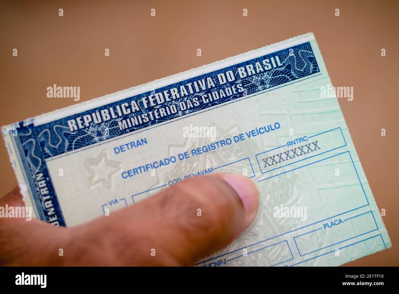 Brazil. 5th Jan, 2021. A man holds vehicle Registration Certificate