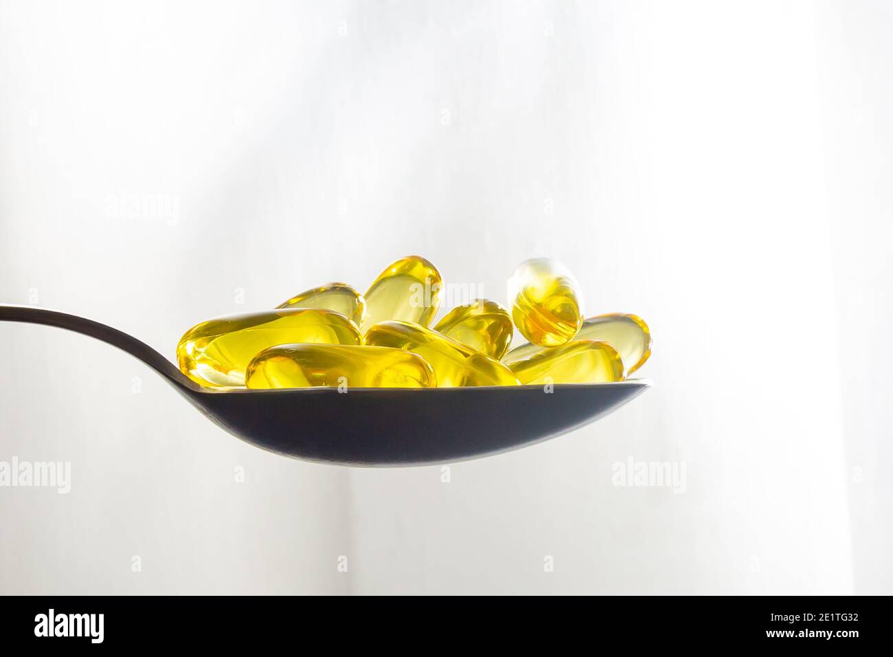 Cod Liver Oil Capsules on spoon omega 3 Stock Photo Alamy