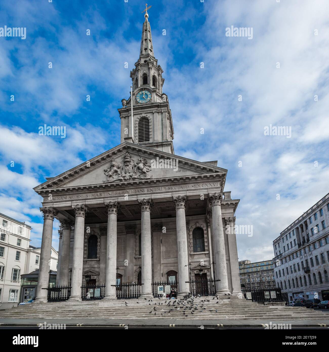 A Homeless Man And His Dog Sits On The Steps Of St Martin in the a-homeless-man-and-his-dog-sits-on-the-steps-of-st-martin-in-the