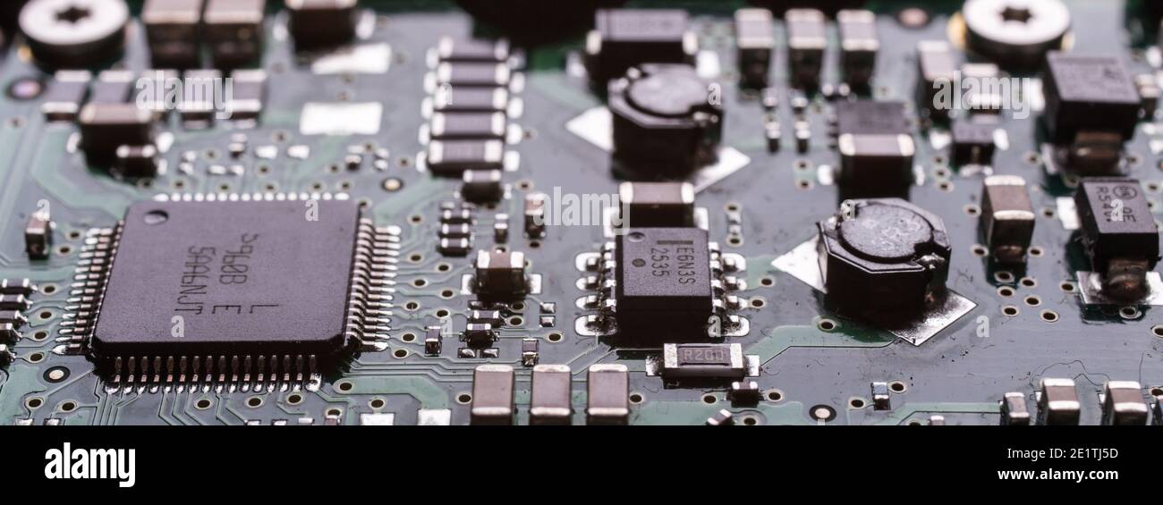 Computer circuits hardware close up. Motherboard parts, chips