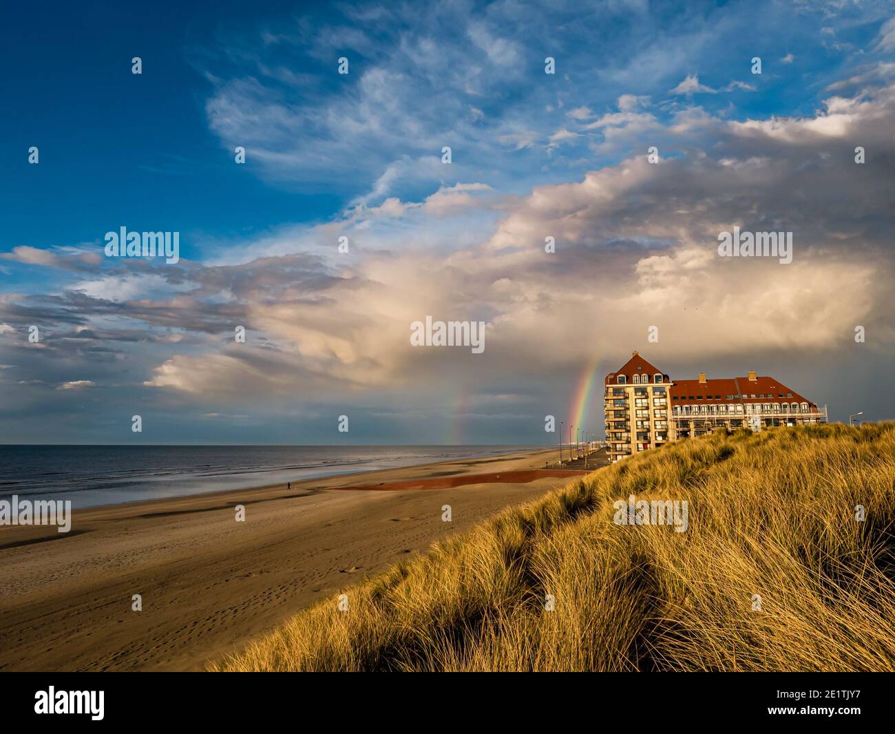 Rainbow in colorful scenery at the beach Stock Photo