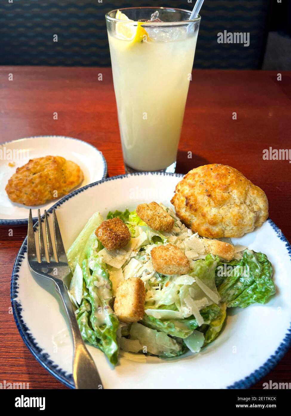 Side Caesar Salad Ice Cold Lemonade at a Sea Food Restaurant Stock
