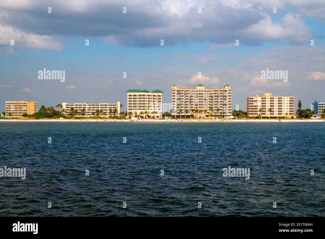 Fort Myers beach Florida holiday vacation destination, coast of Estero Island with beachfront hotel resort buildings, view from the boat Stock Photo