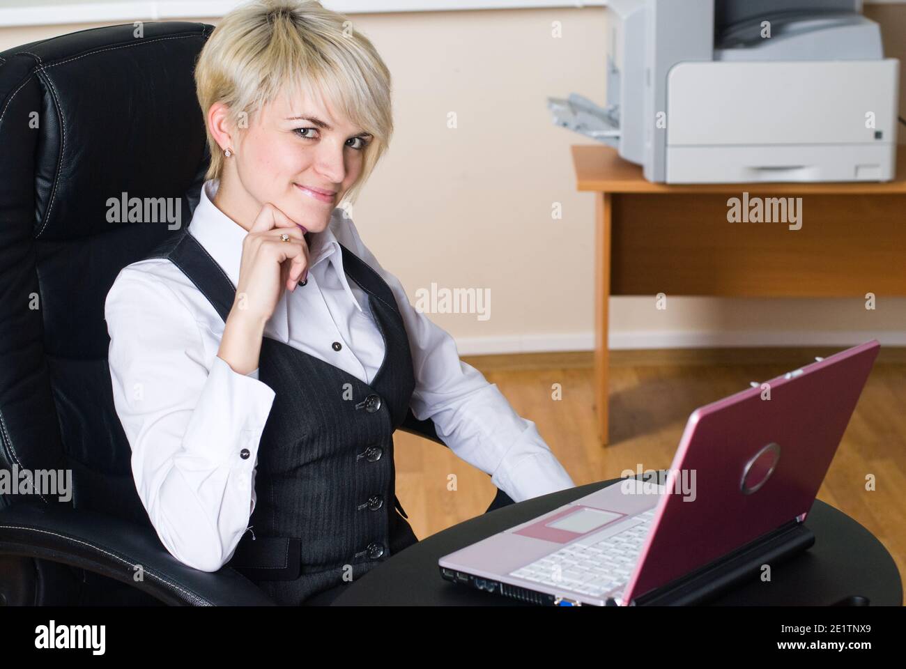 Young lady chief sitting on chair in office Stock Photo Alamy