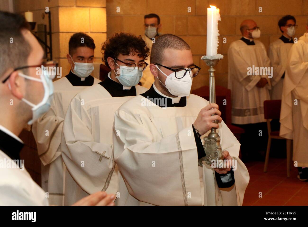 Priests wear surgical masks due to the Covid19 pandemic during mass in