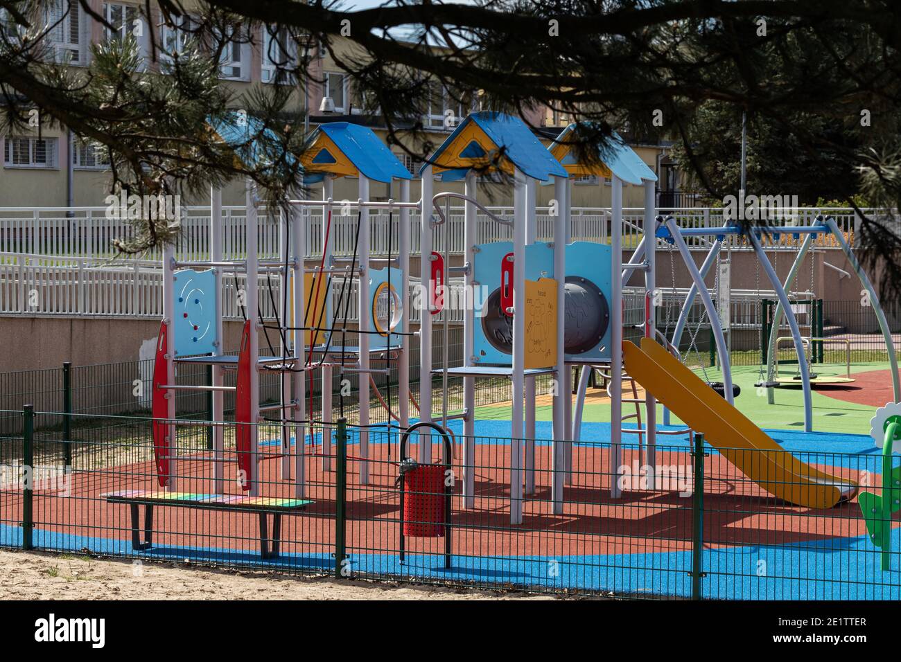 A separate and fenced play area for children with a safe, colorful