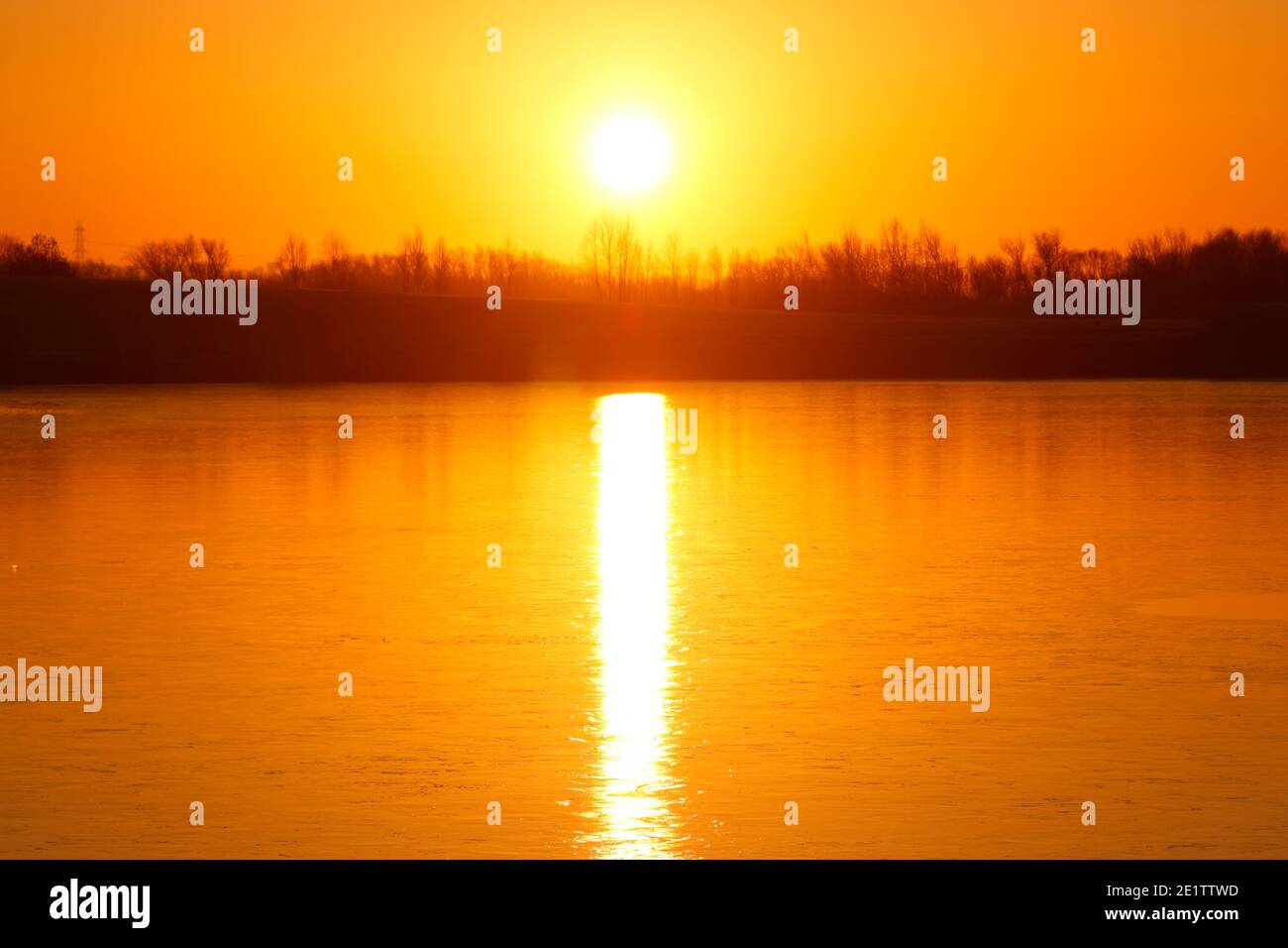 Sunrise over a frozen Bowers Lake at St Aidan's Nature Park in