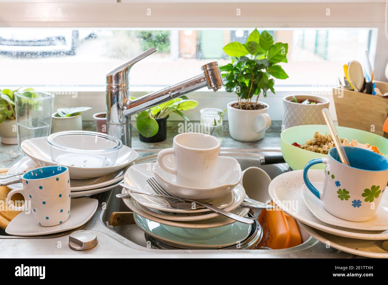 https://c8.alamy.com/comp/2E1TTXH/messy-kitchen-counter-with-pile-of-dirty-dishes-in-sink-compulsive-hoarding-syndrome-2E1TTXH.jpg