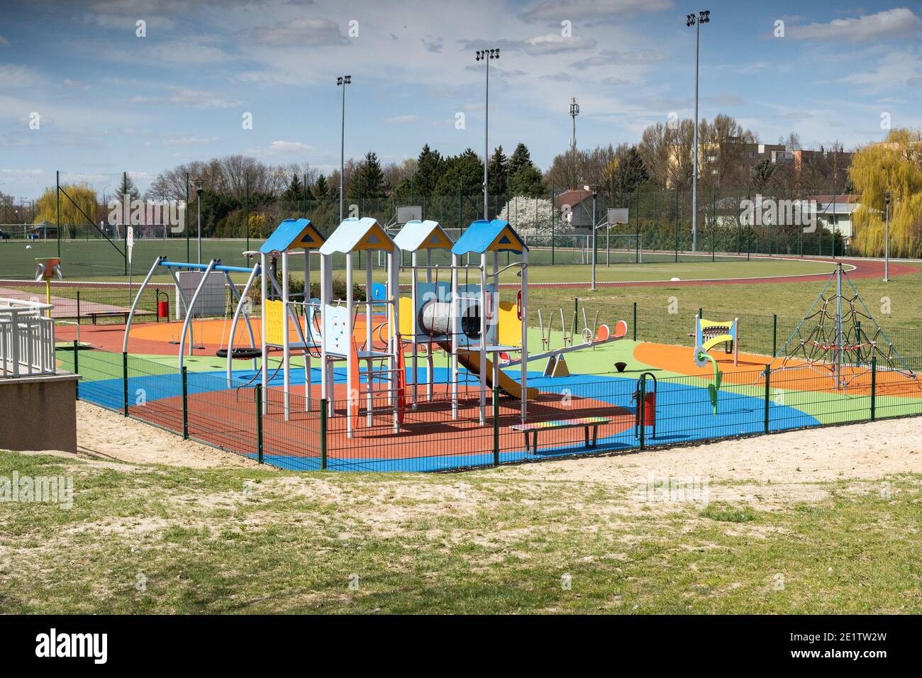 A separate and fenced play area for children with a safe, colorful