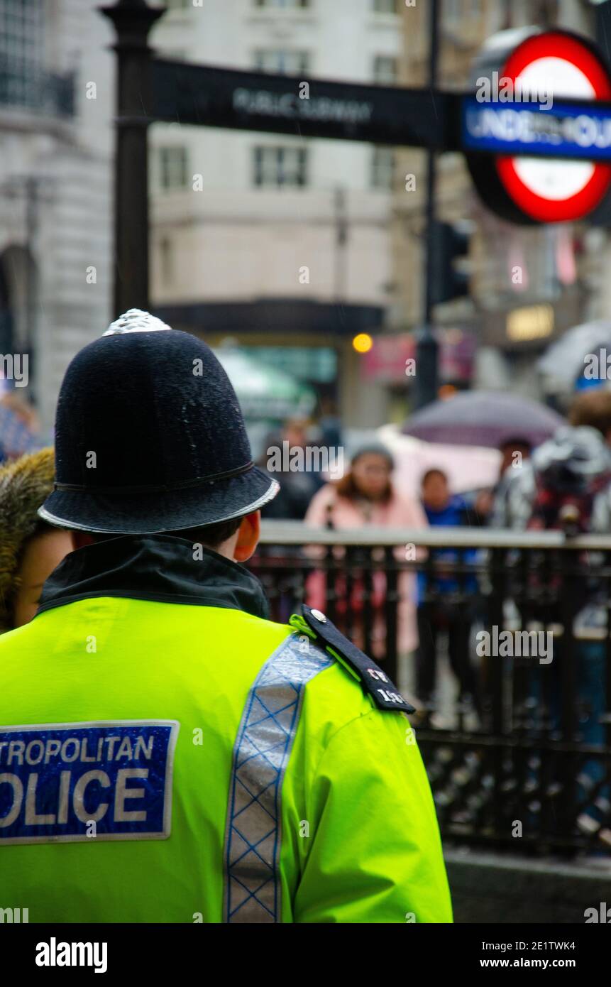 London, UK - April 03-2015 Police officers patrolling Leicester Square and Piccadilly Circus in central London.A British Transport policeman keeping a Stock Photo