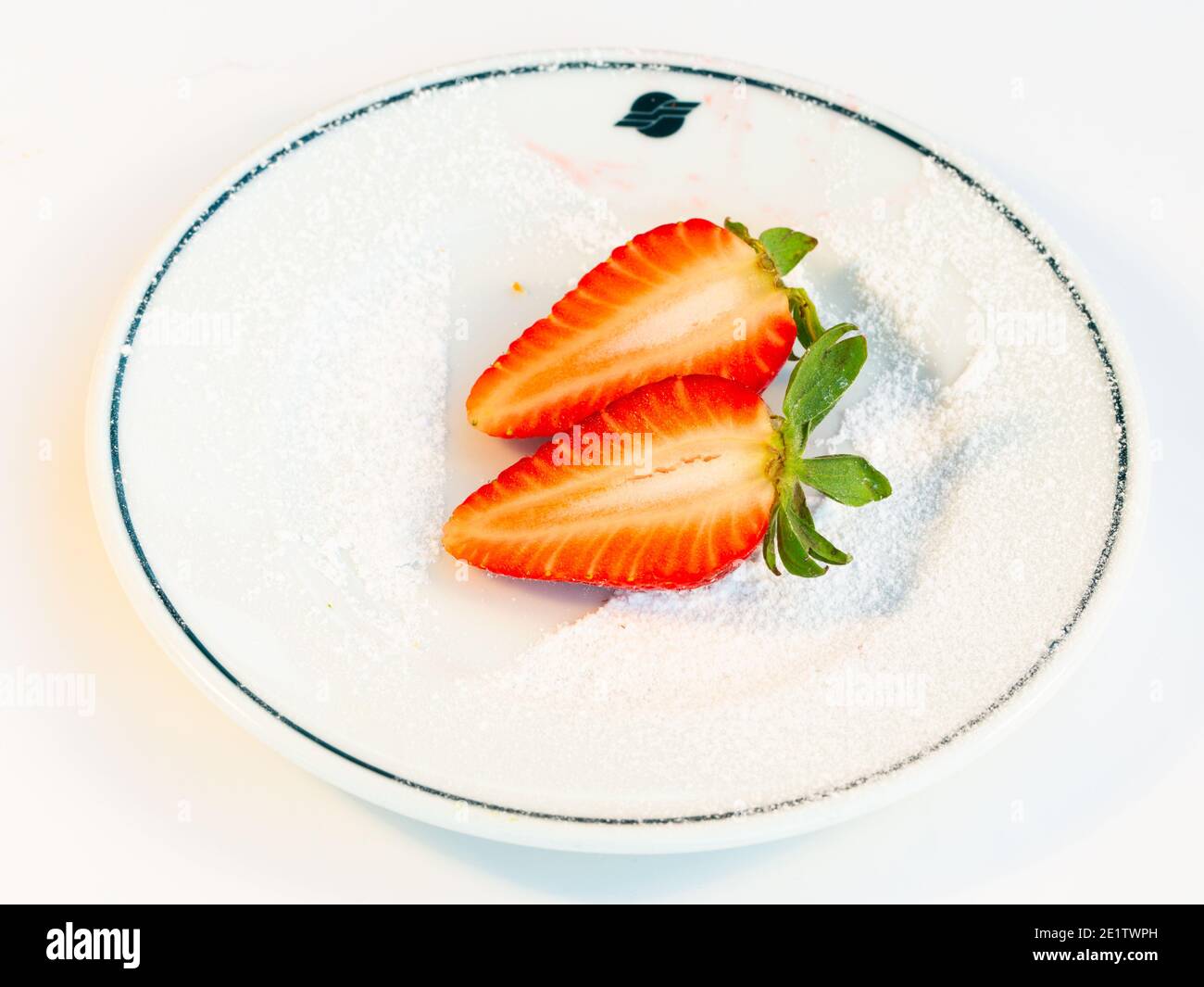 Strawberry in a plate isolated on white background Stock Photo - Alamy