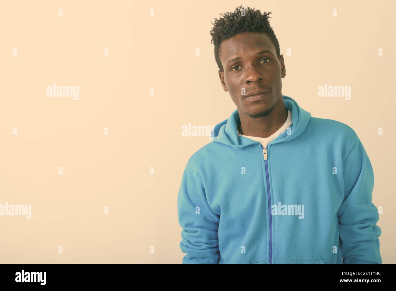 Close up of young black African man against white background Stock Photo