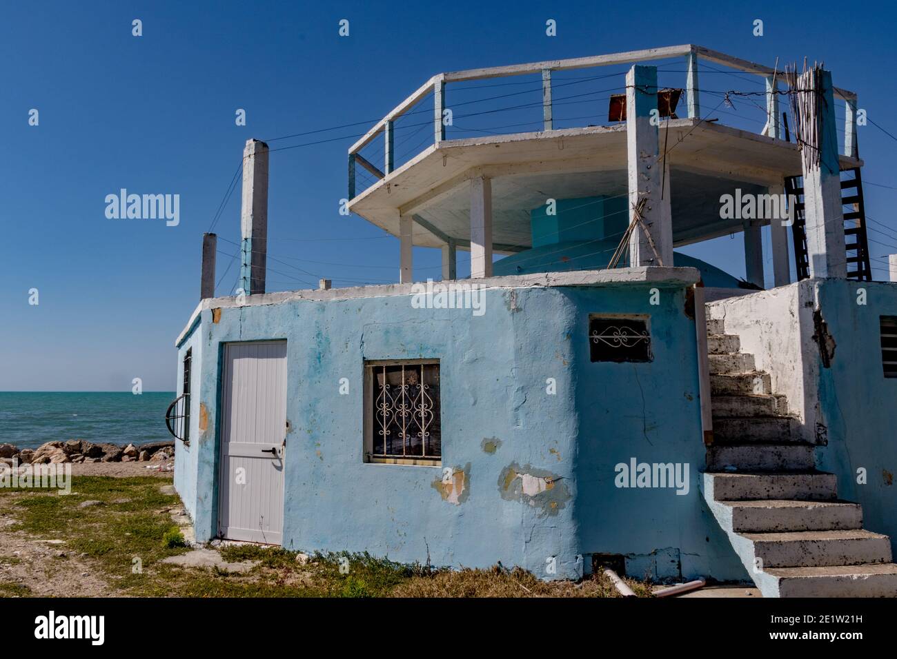 A nuclear shelter is repurposed into a summer pizza restaurant, Albania. Communist-era bunkers were built by dictator Enver Hoxha during the Cold War. Stock Photo