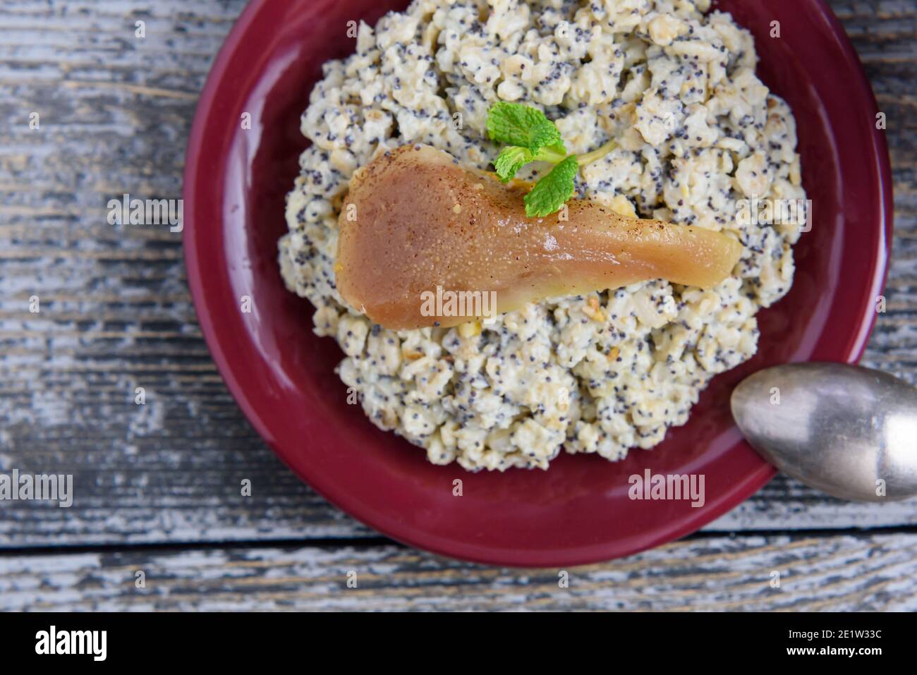 Poppy seed porridge with orange peel and pears, flat lay, bright colors Stock Photo