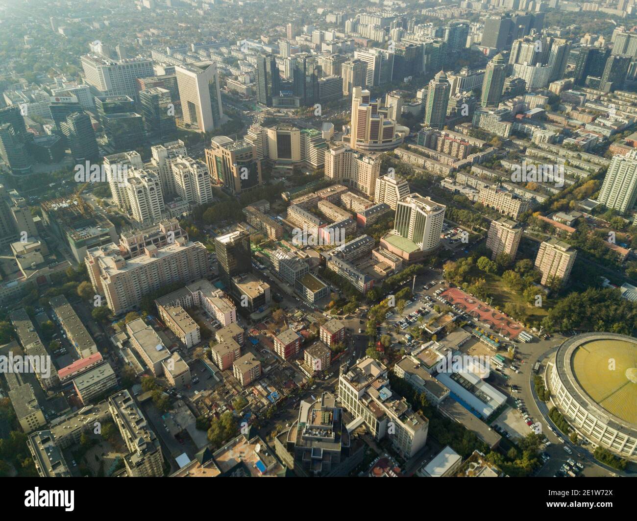 Aerial view of the city skyline with buildings and high rises on a day with light smog in the Dongcheng and Chaoyang district of the Chinese capital city of Beijing, China, PRC. © Time-Snaps Stock Photo