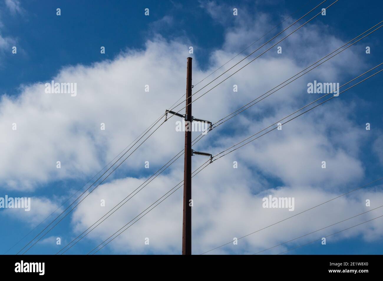 Blue sky and white clouds with utility pole and wires Stock Photo - Alamy