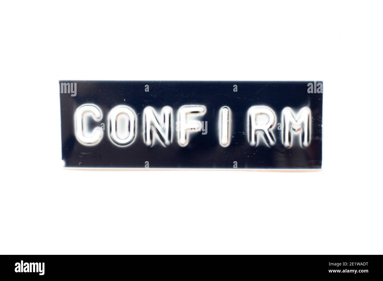 Embossed letter in word confirm on black banner with white background