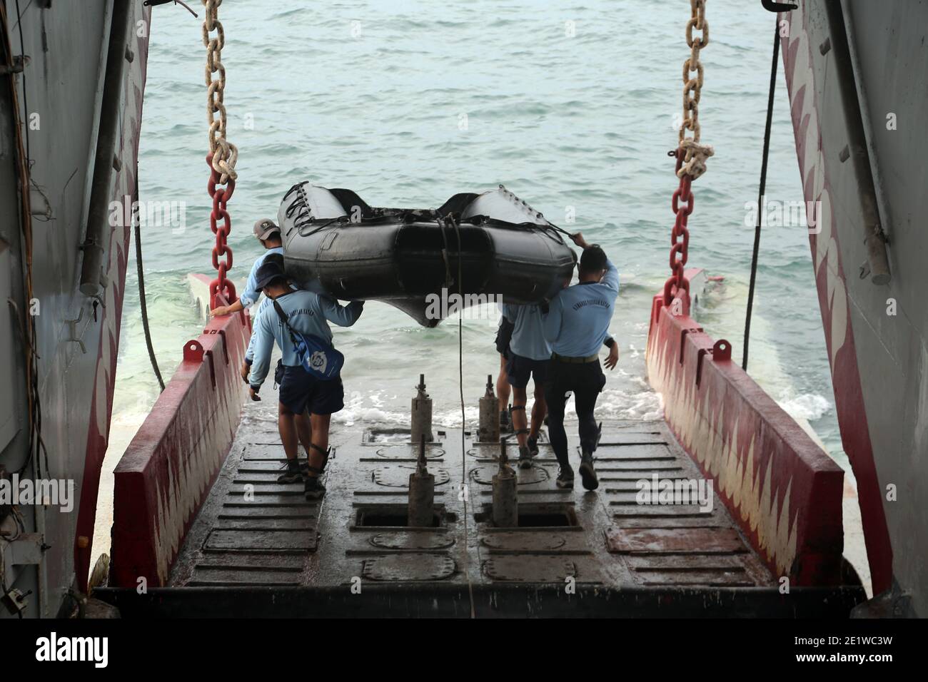 Indonesian Navy Divers carry their Rigid inflatable boat for rescue operation search Sriwijaya Airlane flight SJ 182 that lost contact after taking off, On KRI Gilimanuk Ship.  According to an airline spokesperson, contact to Sriwijaya Air flight SJ182 was lost on 09 January 2021 shortly after the aircraft took off from Jakarta International Airport while en route to Pontianak in West Kalimantan province. A search and rescue operation is under way. Stock Photo