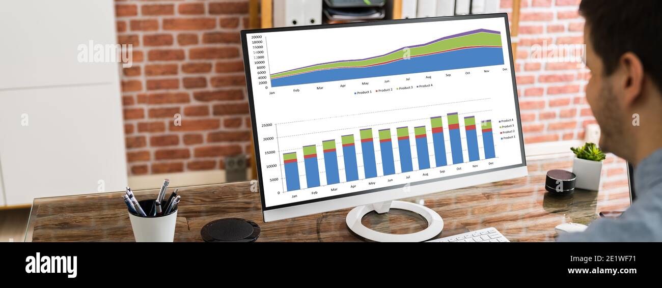 Data Analyst Using Charts And Graphs On Computer Stock Photo - Alamy