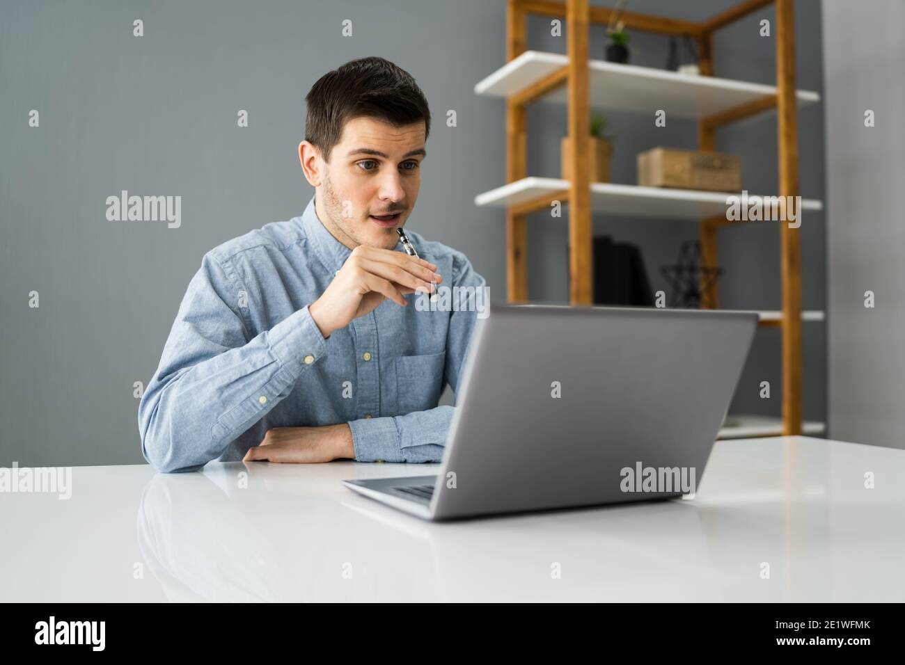 Virtual Smoking Break Using Electronic Cigarettes And Video Conference Stock Photo