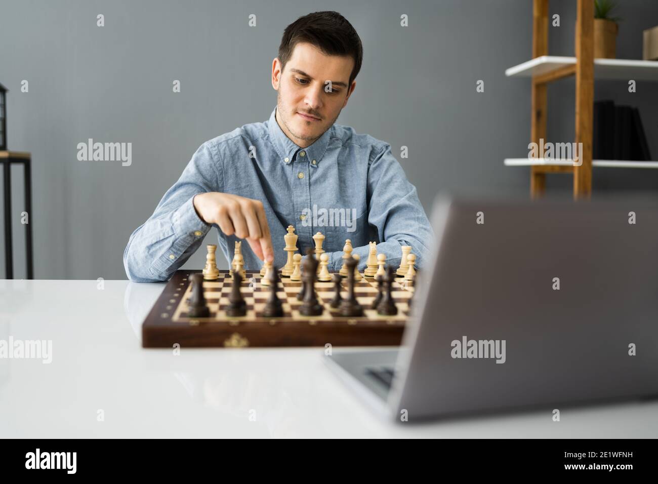 Man Playing Chess Against Computer Stock Image - Image of defeat