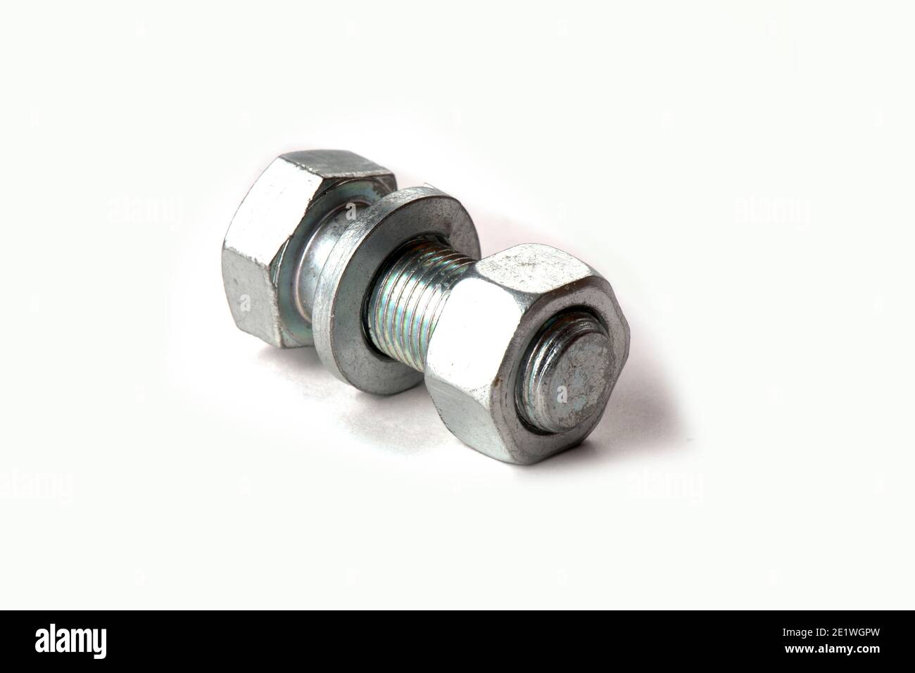 metal bolt, nut and washer assembly, isolated on a white background