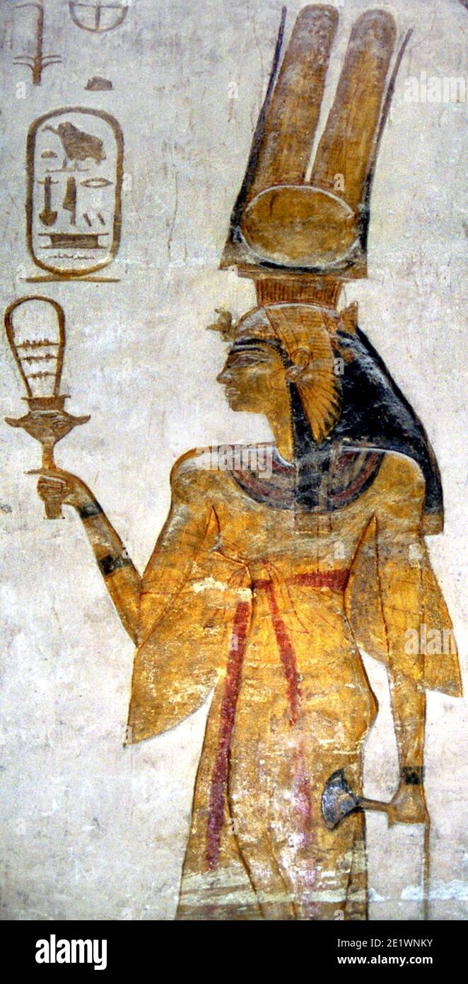 6703. Queen Nefertari, wife of Pharaoh Ramesses II , holding a sistrum (musical instrument), wall painting from a tomb in Abu Simbel. Stock Photo