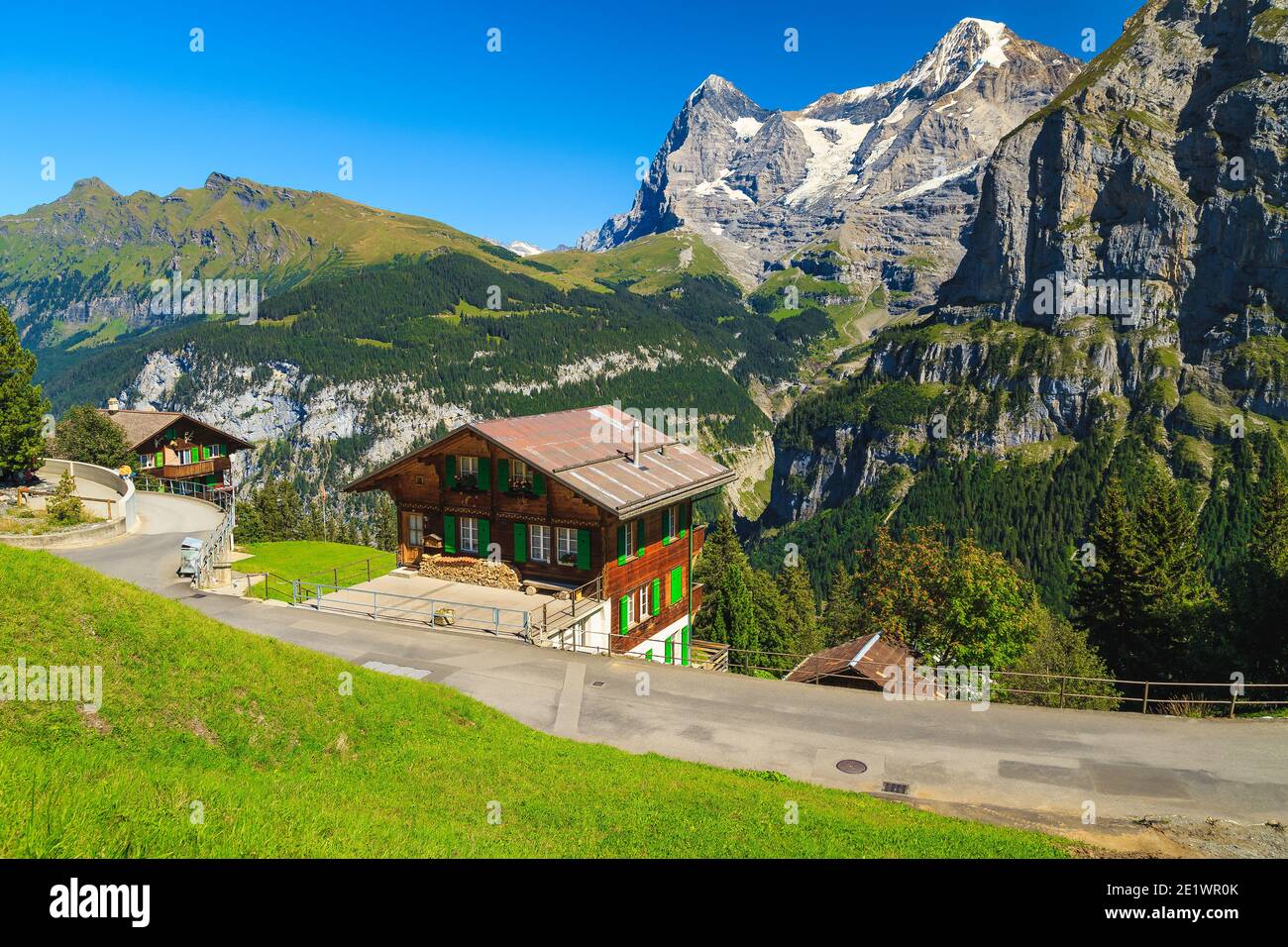 Famous mountain resort with old wooden houses and high mountains in background, Murren, Bernese Oberland, Switzerland, Europe Stock Photo