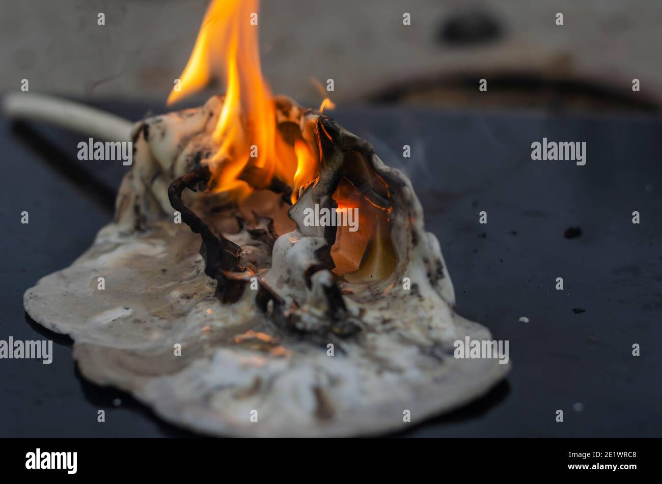 Household electrical appliance fire concept. Final stage of power strip