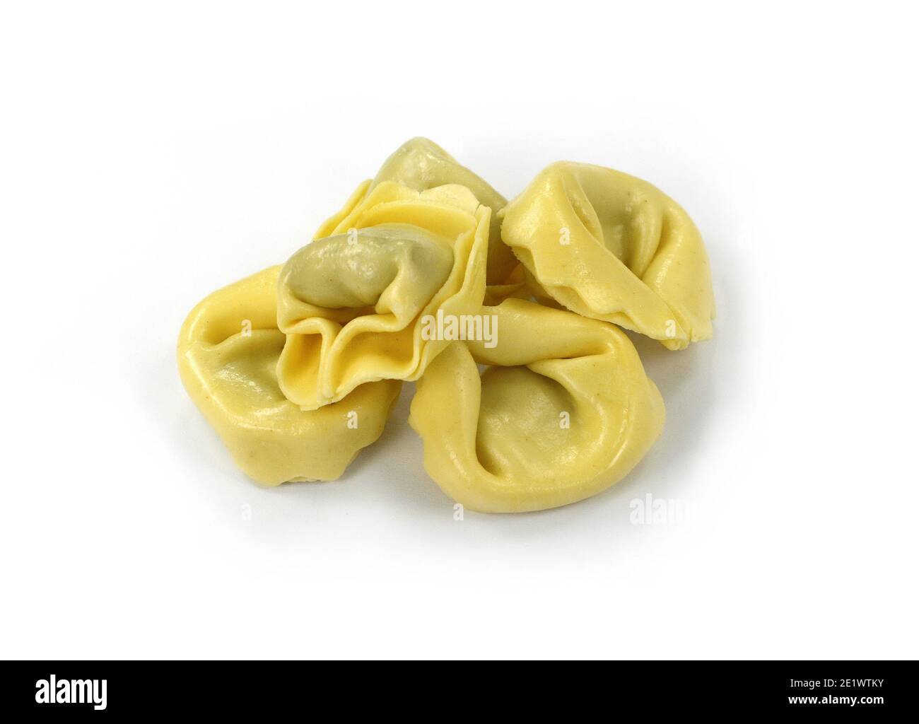 Italian traditional tortellini pasta or ravioli stuffed with spinach isolated on white