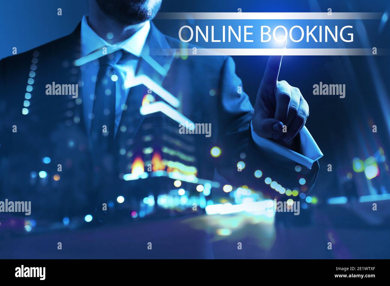 Businessman using virtual screen for online booking at night Stock Photo