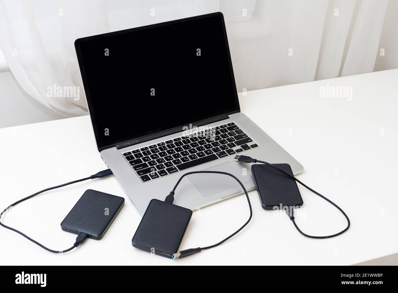 External backup disk hard drive connected to laptop Stock Photo Alamy